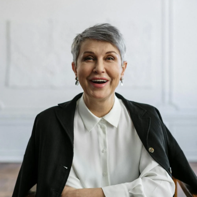 older adult woman therapist, smiling with month open to speak