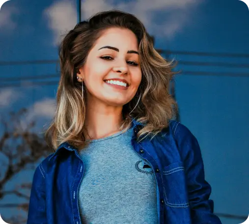 a lady smiling with a blue jean jacket