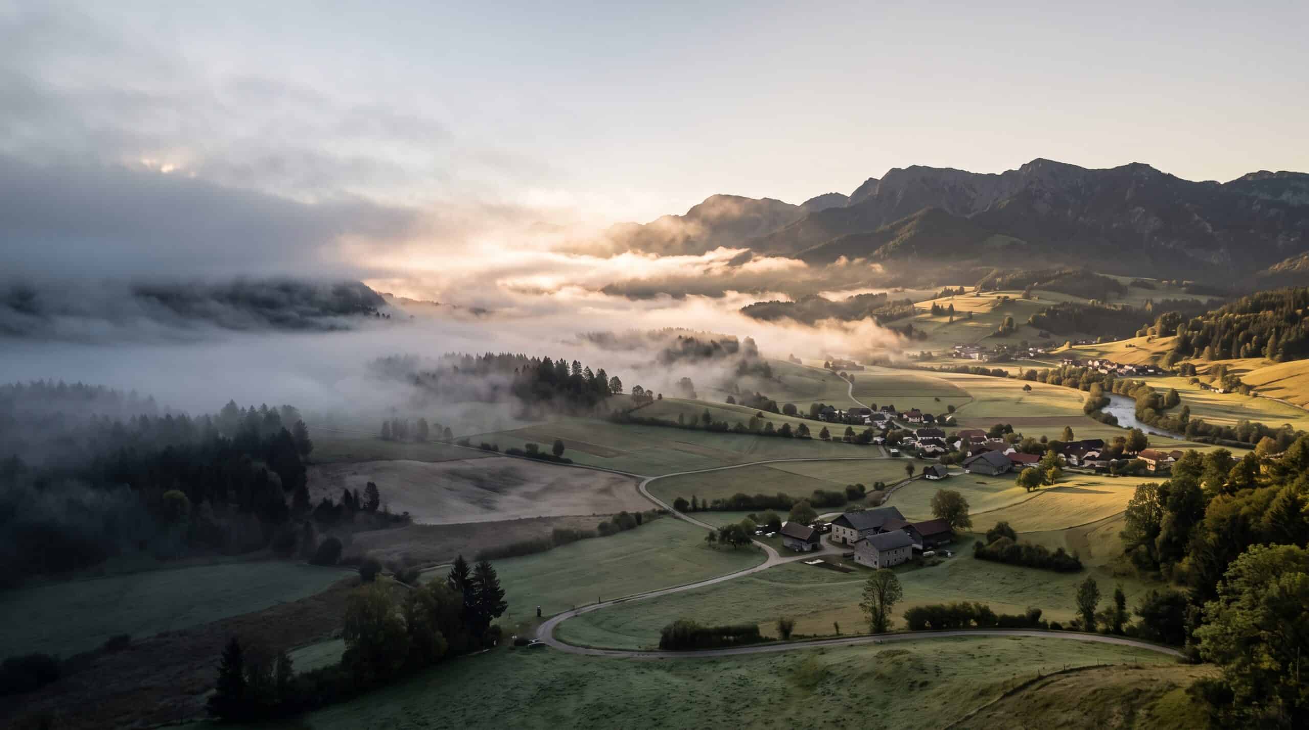 Fog dissolving over a valley